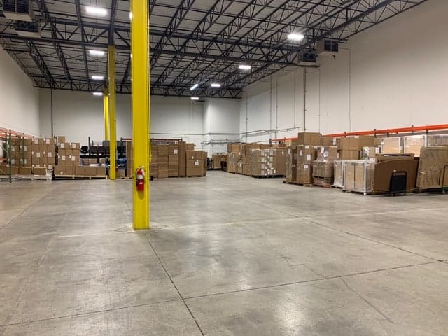 Warehouse holding office furniture.