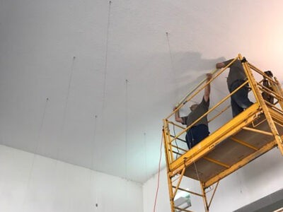 scaffolding-and-ceiling-cable-installation On Point Installations’ specialists on the scaffold, installing ceiling cables